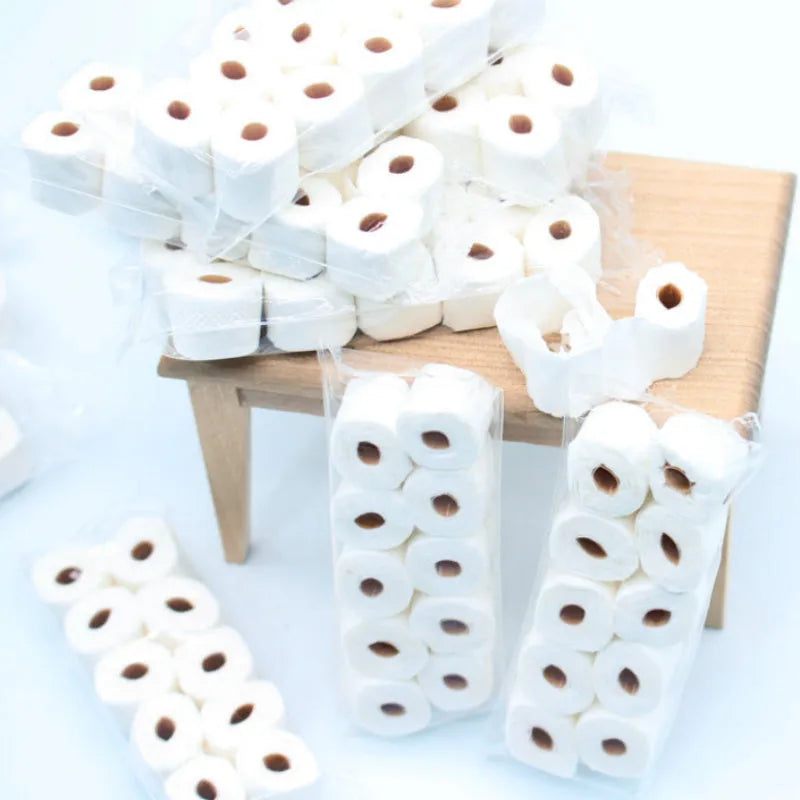 Miniature paper tissue roll model measuring 30mm wide by 15mm deep by 80mm high