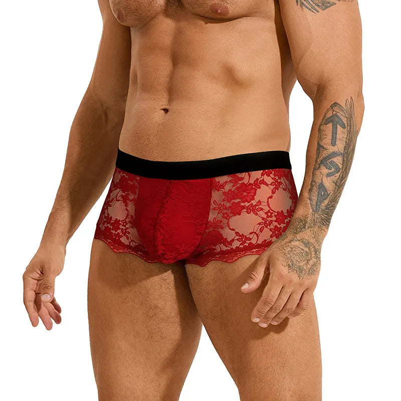 Men's black lace briefs with hollow-out see-through panels laid flat