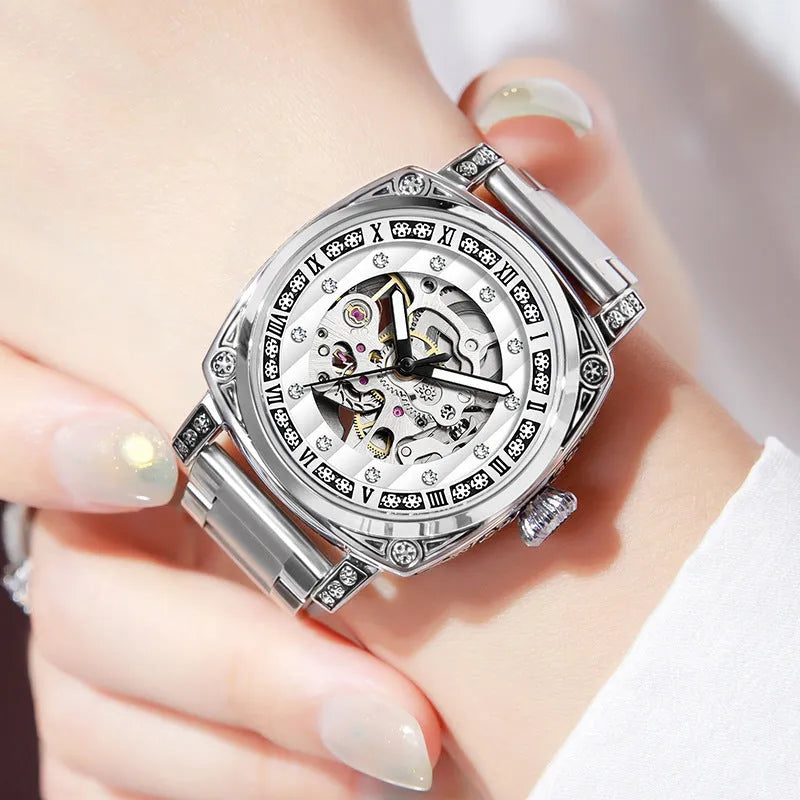 Mechanical watch with leather strap and luminous hands on a dial, shown in multiple colour options.