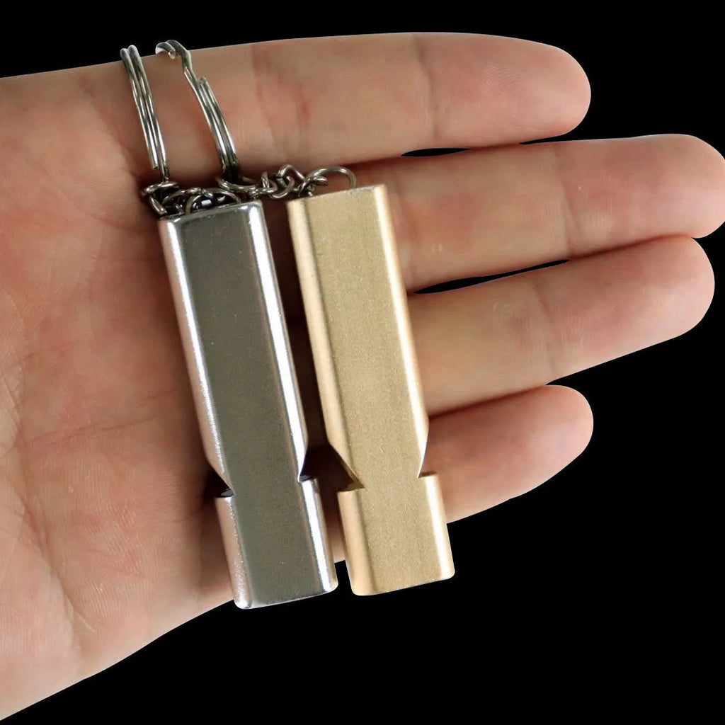 Silver and gold coloured aluminium alloy double-hole outdoor survival whistle with keychain.