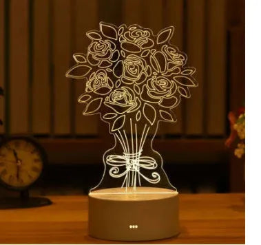 3D acrylic USB LED night light with unicorn design and warm white projection on a desk