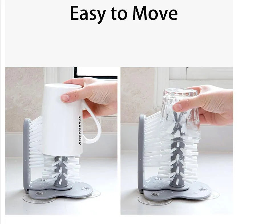 Grey kitchen cleaning brush with two brush heads and suction cups for wall mounting