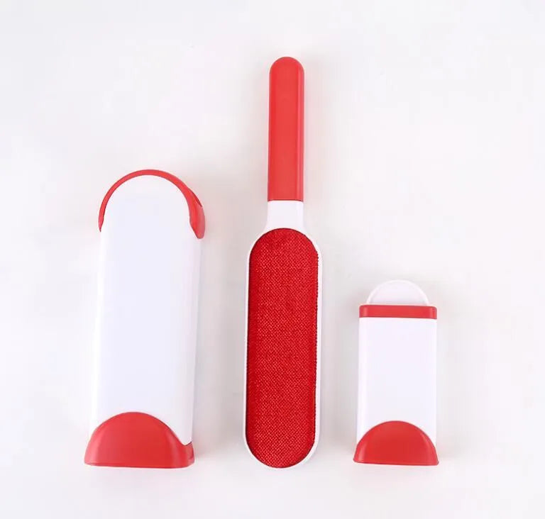 Blue reusable pet hair removal comb with double-sided sticky brush next to its self-cleaning base.