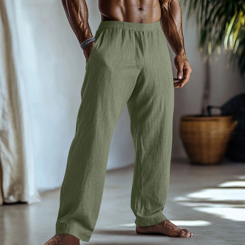 Straight leg casual trousers in cotton and linen fabric, shown in light green colour with side pockets.