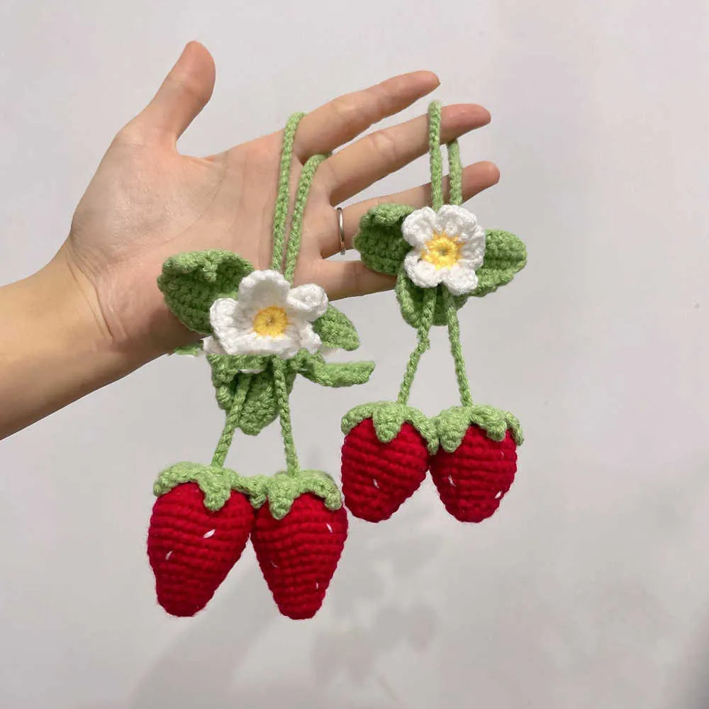 Handmade strawberry-shaped car pendant made with knitted cotton and hemp wool.