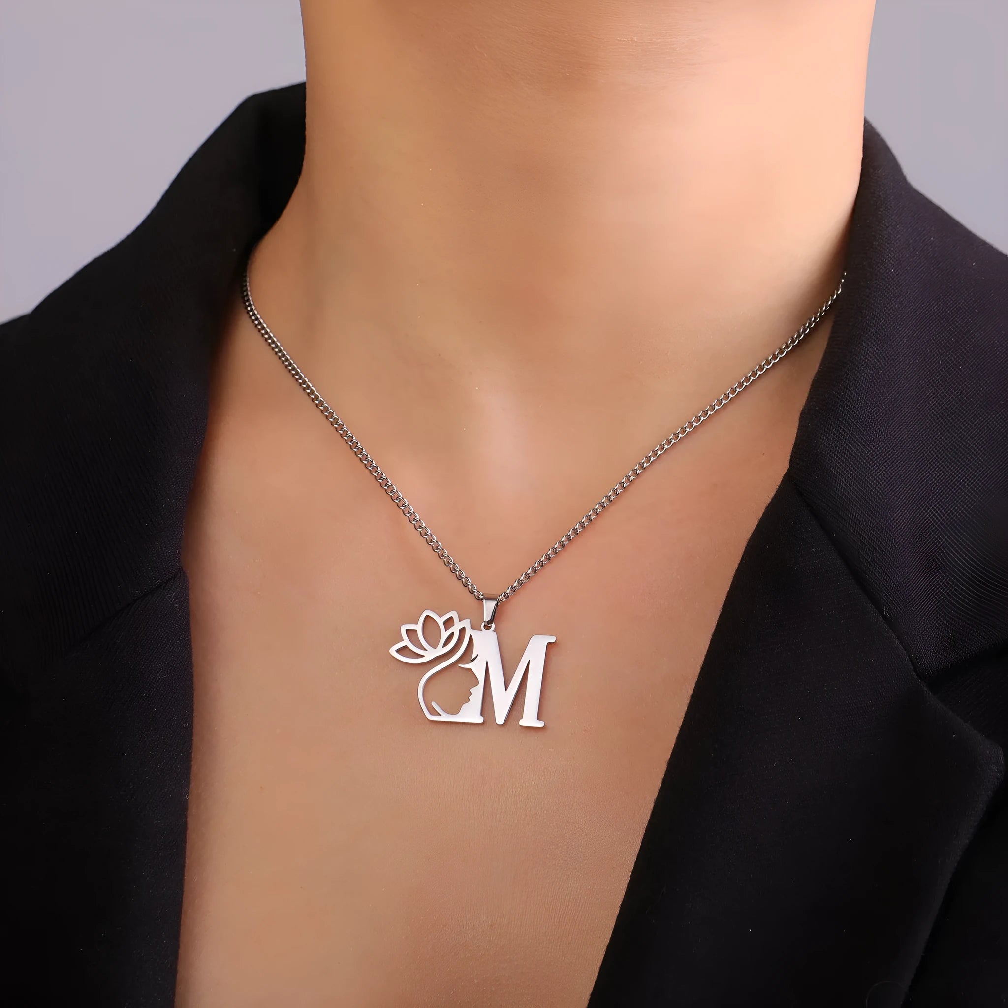 Stainless steel cross chain necklace with a single pendant, shown in gold and silver colour options.