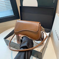 Retro women's messenger bag in black PU leather with horizontal square shape and double shoulder straps.