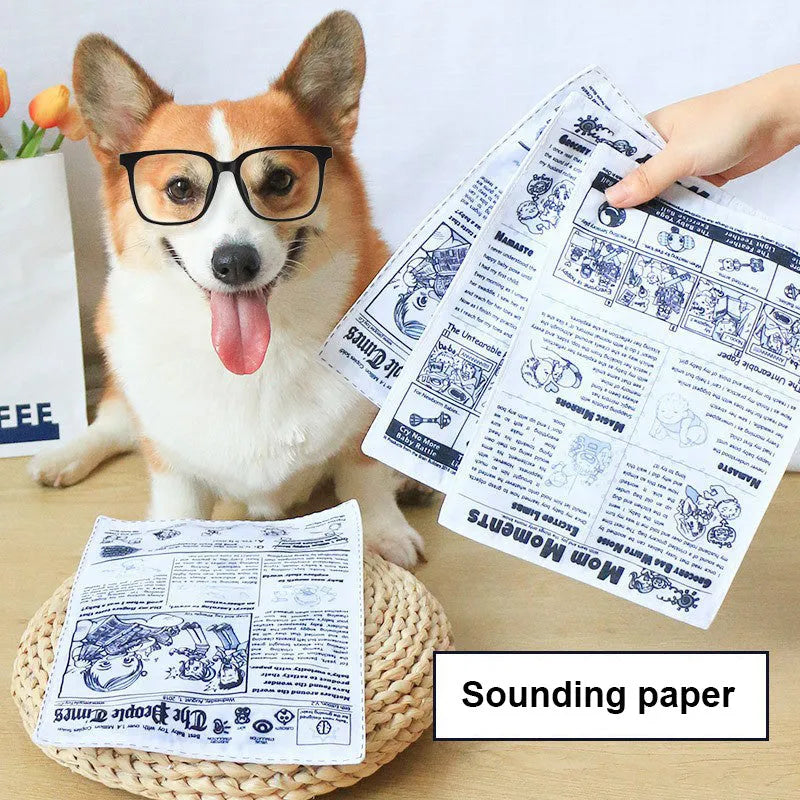 Tear-resistant dog toy with newspaper and playing card prints featuring a squeaker inside
