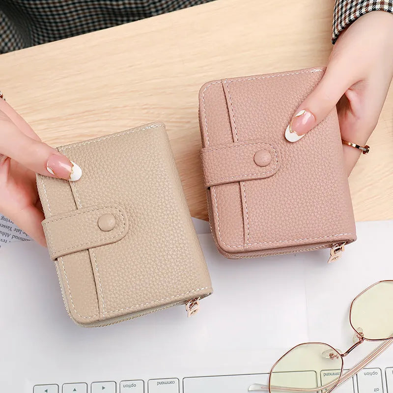 Ladies' short wallet with lychee pattern in pu leather, two-fold compact design