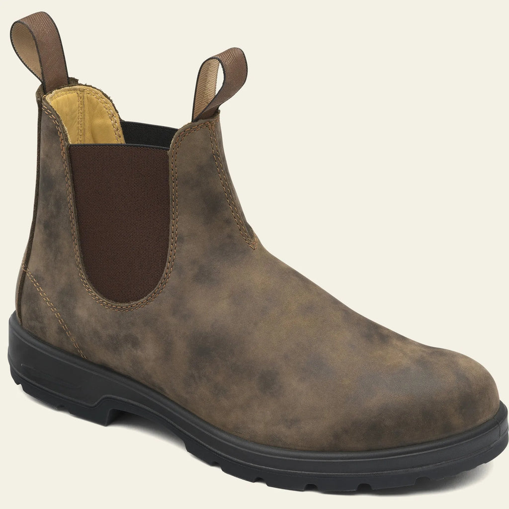 Vintage brown unisex Chelsea boots with car stitching and a low horse hoof heel.