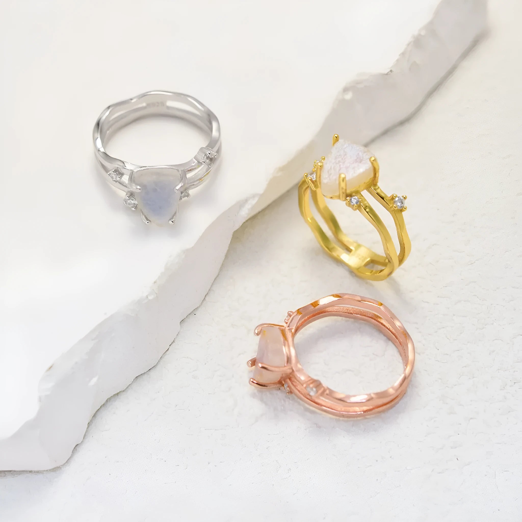 S925 sterling silver geometric ring with an irregular triangle moonstone in a choice of rose gold, white gold, or yellow gold finish.