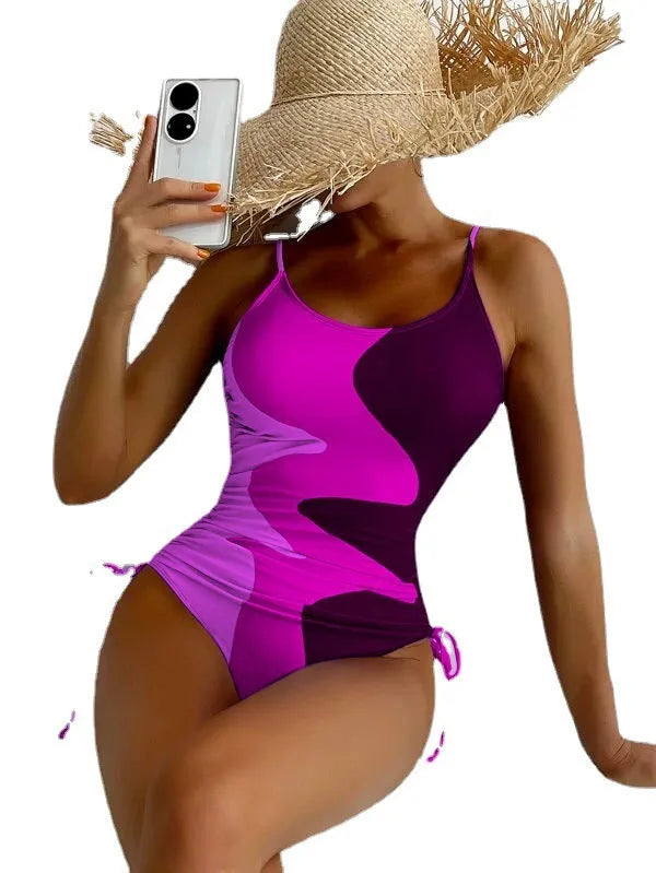 Women's sleeveless one-piece swimsuit in a choice of blue, purple, brown, or green colours.