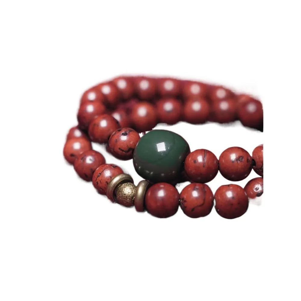 Close-up of a handmade double circle bracelet crafted from brown bodhi seeds on a wrist.