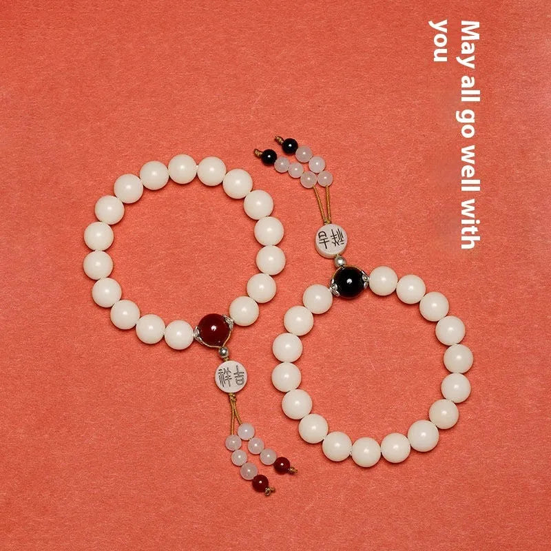 White jade bodhi couple bracelet with ruyi element and 10mm round beads.
