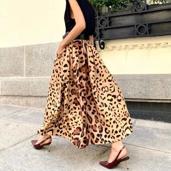 Brown leopard print women's A-line long skirt on a hanger.