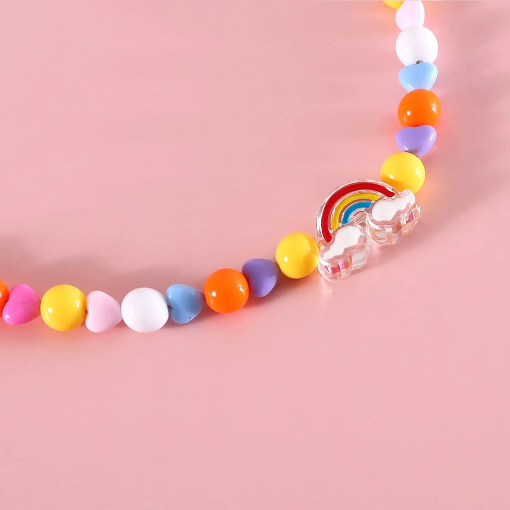 Colourful plastic bead pet necklace for small cats and dogs in peach, rainbow, and small flower designs.