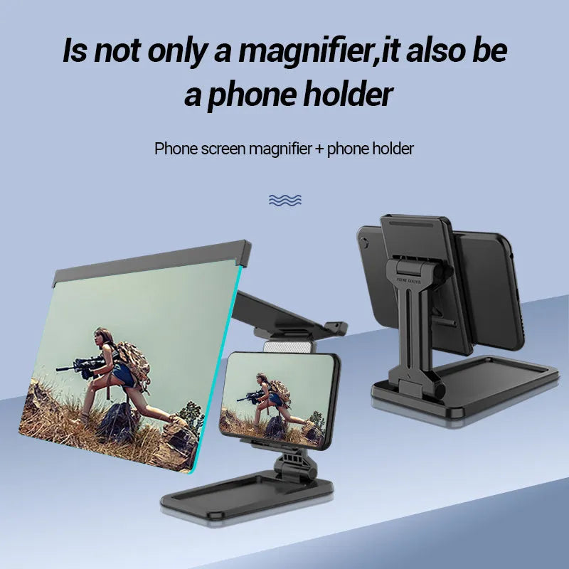 Black folding mobile phone screen amplifier with detached phone holder on a desk