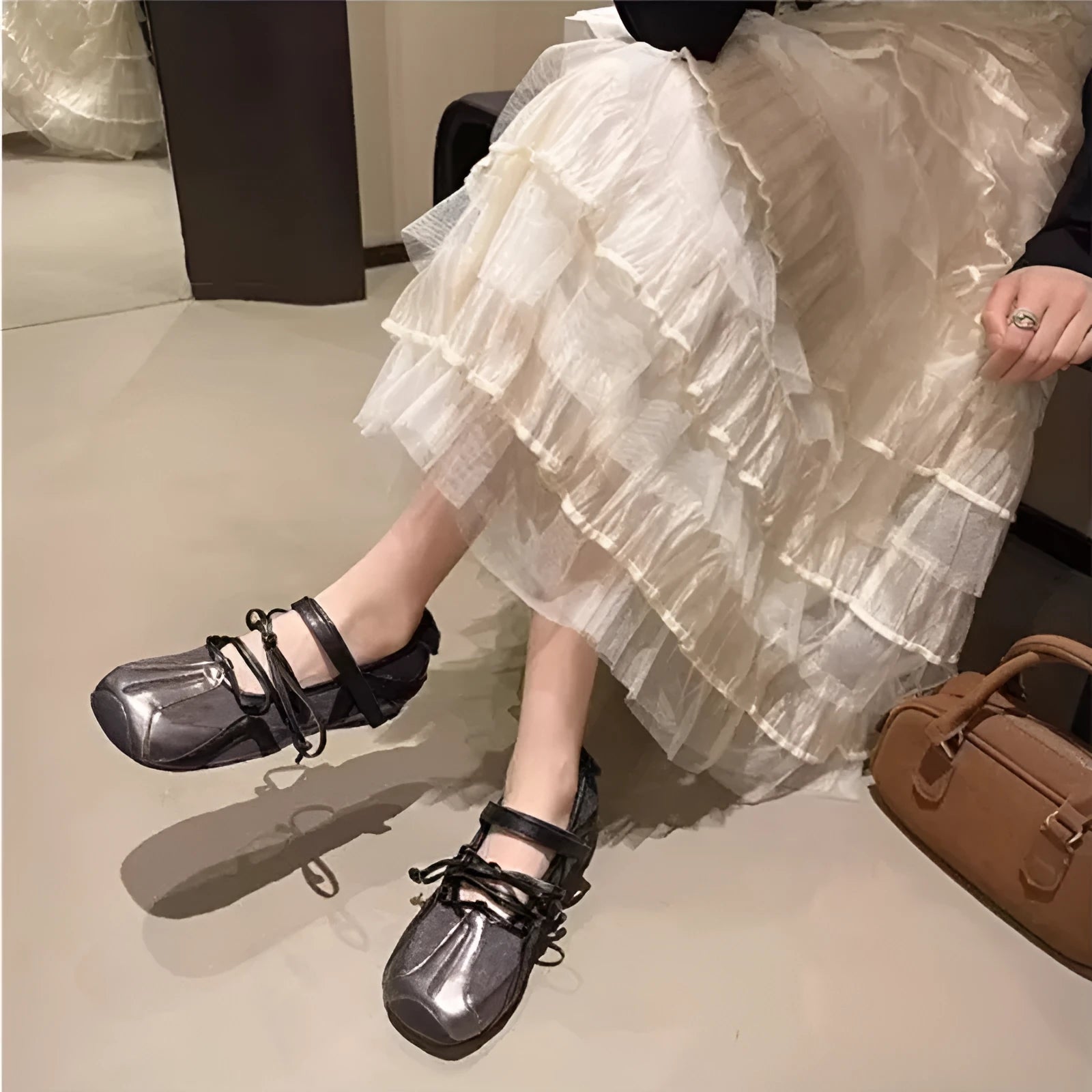 Women's Mary Jane style ballet shoes with round toe and front lace-up closure in artificial leather