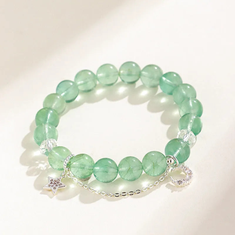 Green fluorite and white crystal star moon princess bracelet with electroplated setting and diamond-shaped stones.