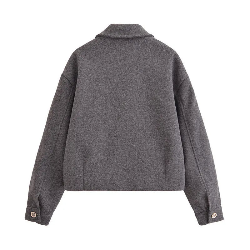 Women's gray PU jacket with shirt-collar, zip front, and long sleeves on a model