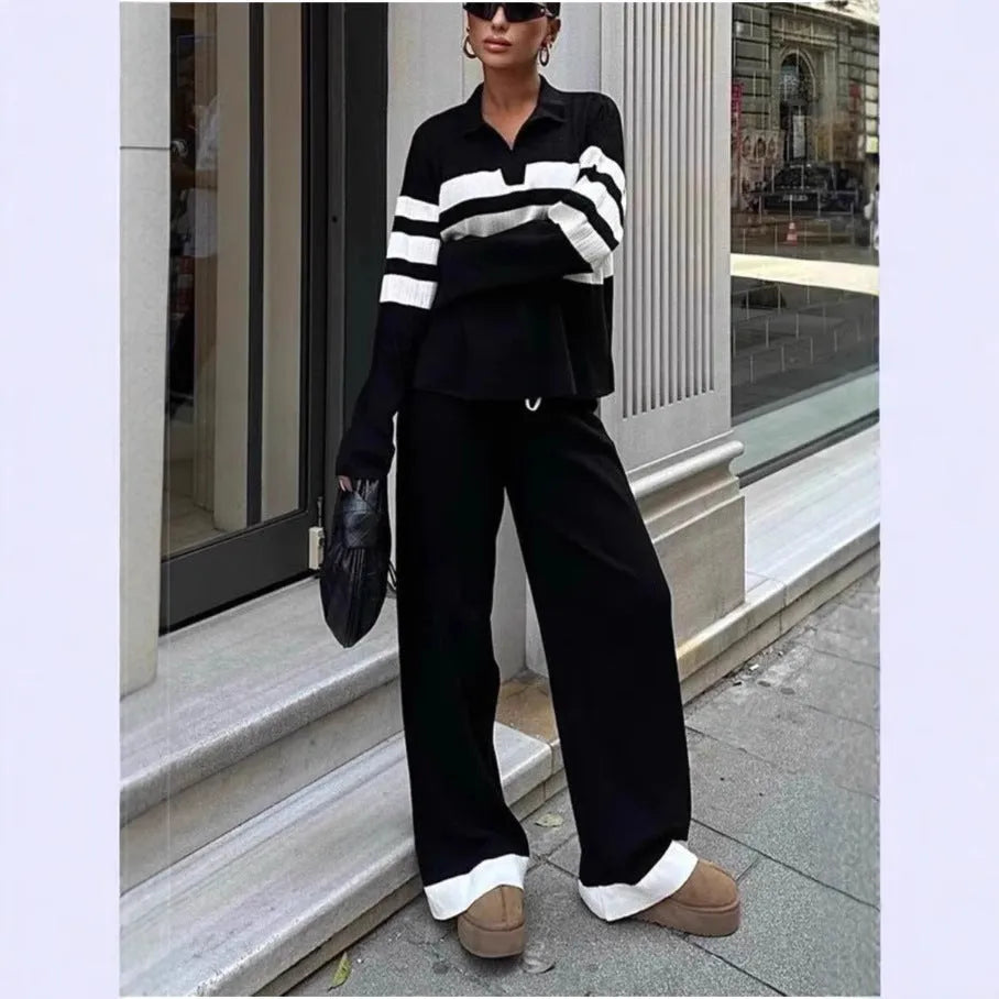 Women's black and white striped knitted polo collar two-piece set with long sleeves and trousers.