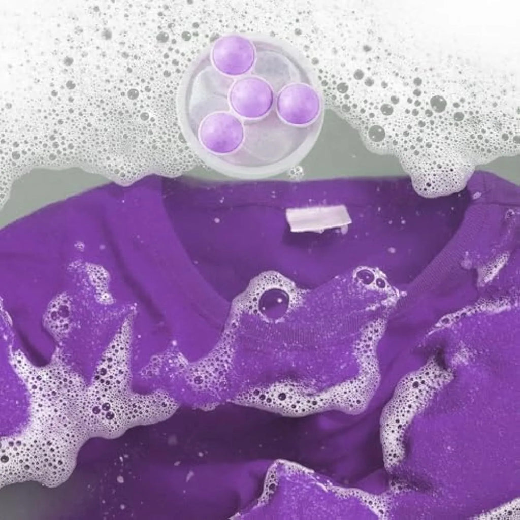 Reusable washing machine filter bag in blue pink purple colours catching pet hair and lint