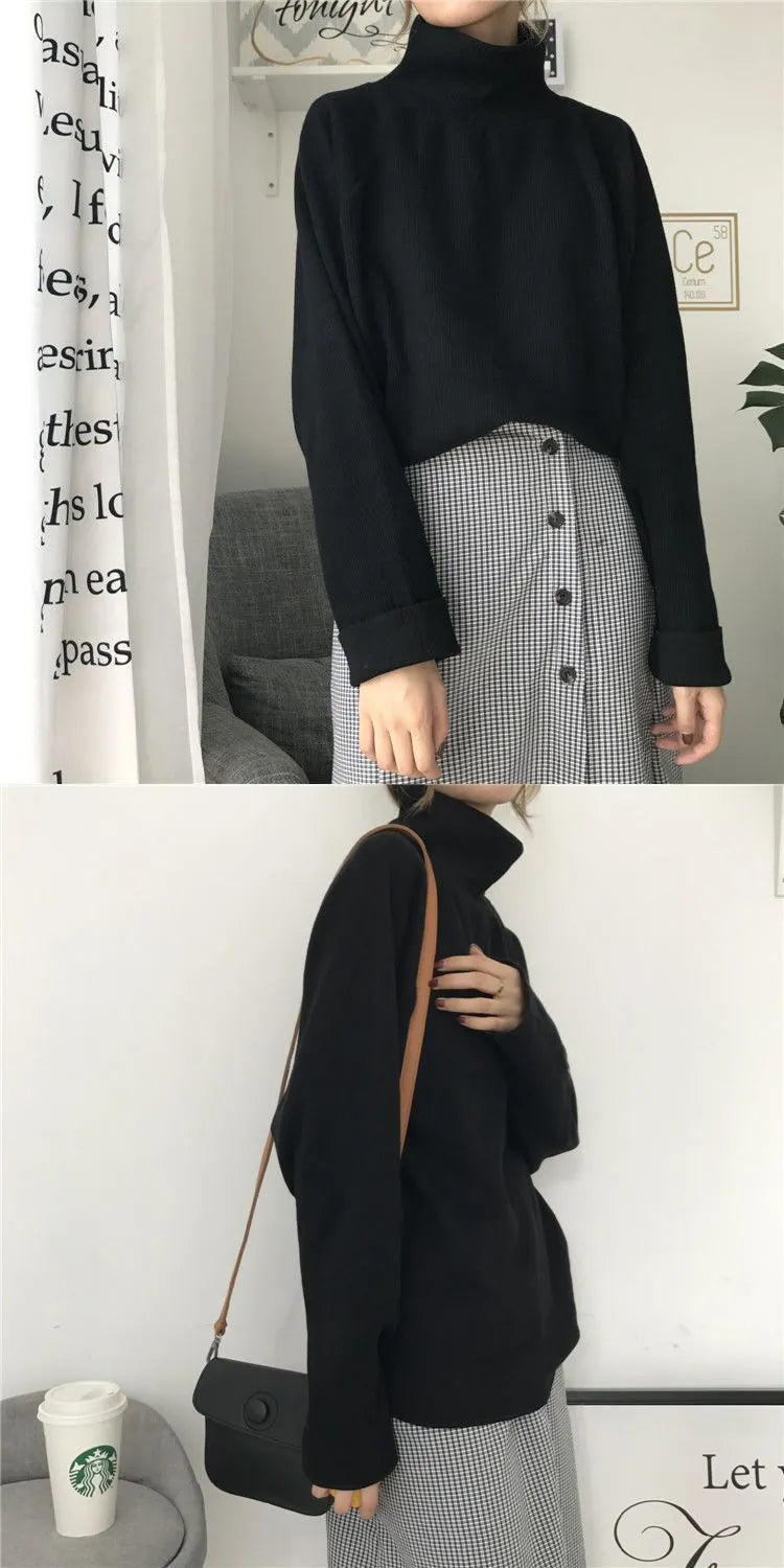 Women's loose-fitting long-sleeve top with a half-high collar in a solid colour.
