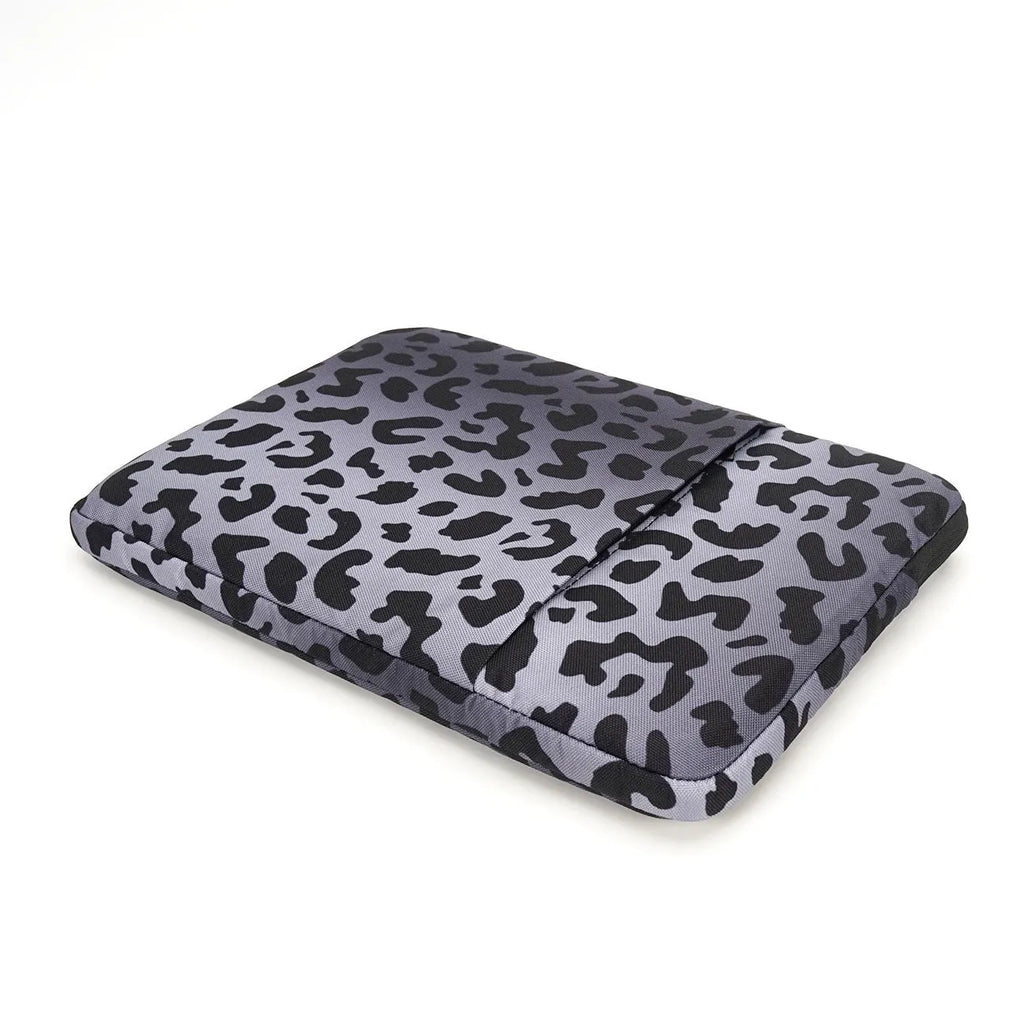 Leopard print laptop sleeve showing anti-shock flannel interior and waterproof polyester exterior for 13-16 inch laptops