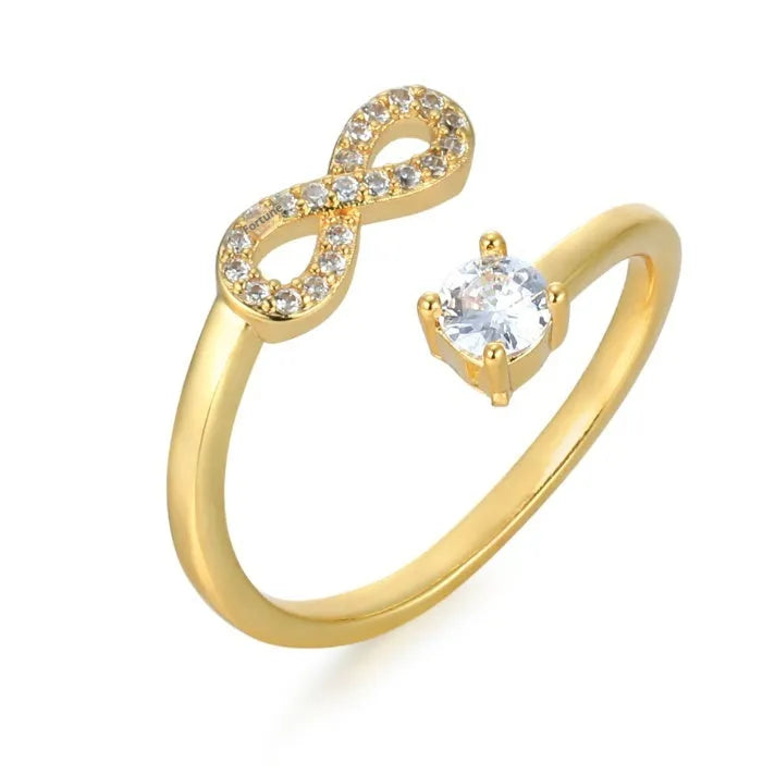 Geometric open zircon letter ring in gold on a hand, showing the detailed character design.