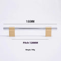 Gold brass single hole drawer handle on white cabinet door – minimalist metal pull