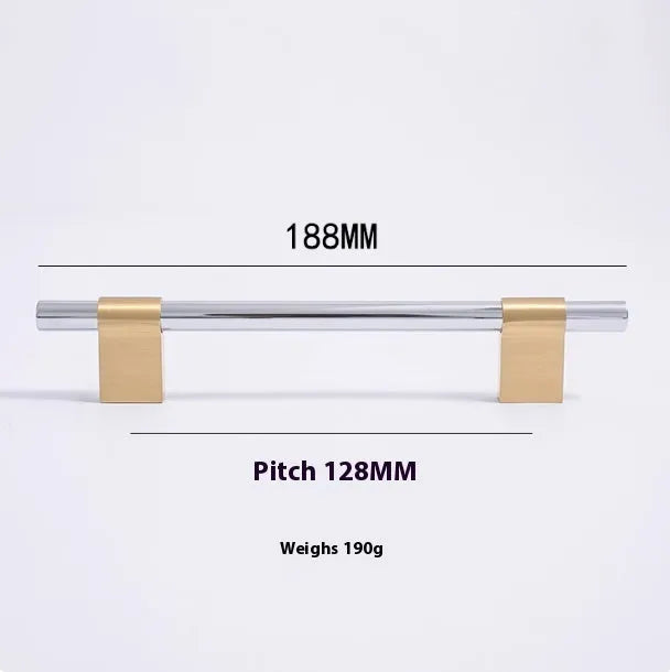 Gold brass single hole drawer handle on white cabinet door – minimalist metal pull