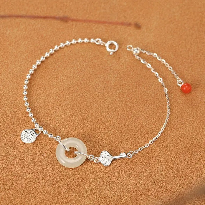 Women's Hetian jade bracelet with 925 silver peace buckle charm in traditional Chinese design