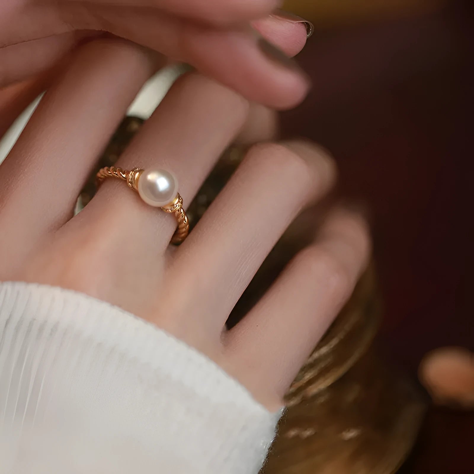 Adjustable copper ring with pearl inlay in gold or silver finish and antique twist design.