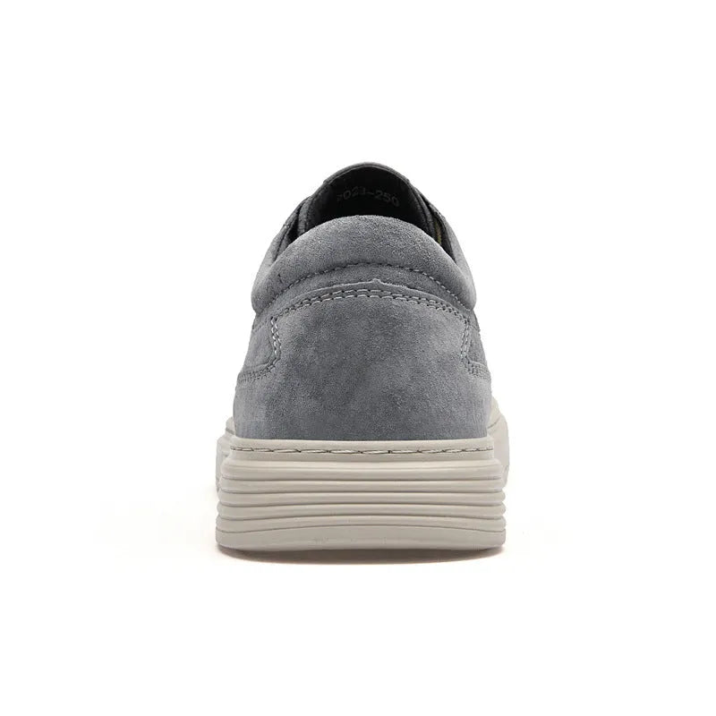 Men's grey pigskin leather casual skate shoes with round toe and flat rubber sole on a light background.