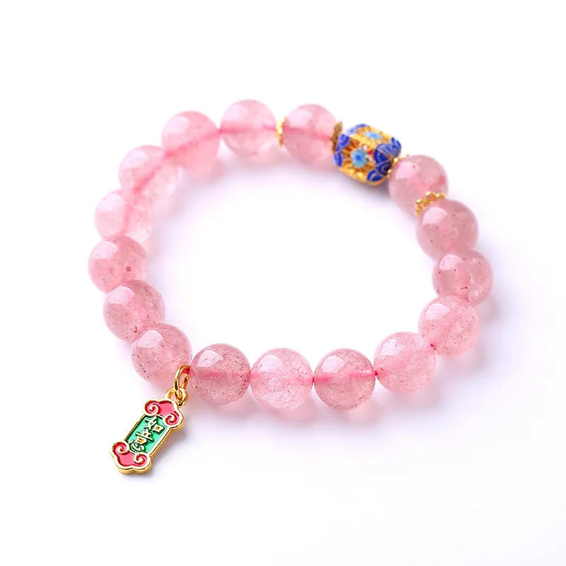 Pink strawberry quartz crystal bracelet with Ruyi charm and hand-woven design for women.