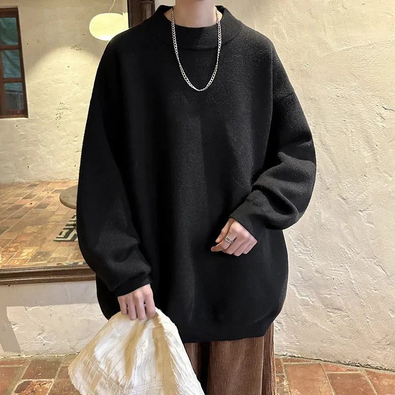 Men's loose fit round neck pullover sweater in a solid colour on a hanger.