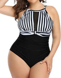 Women's black lace one-piece swimsuit on a hanger showing the front design