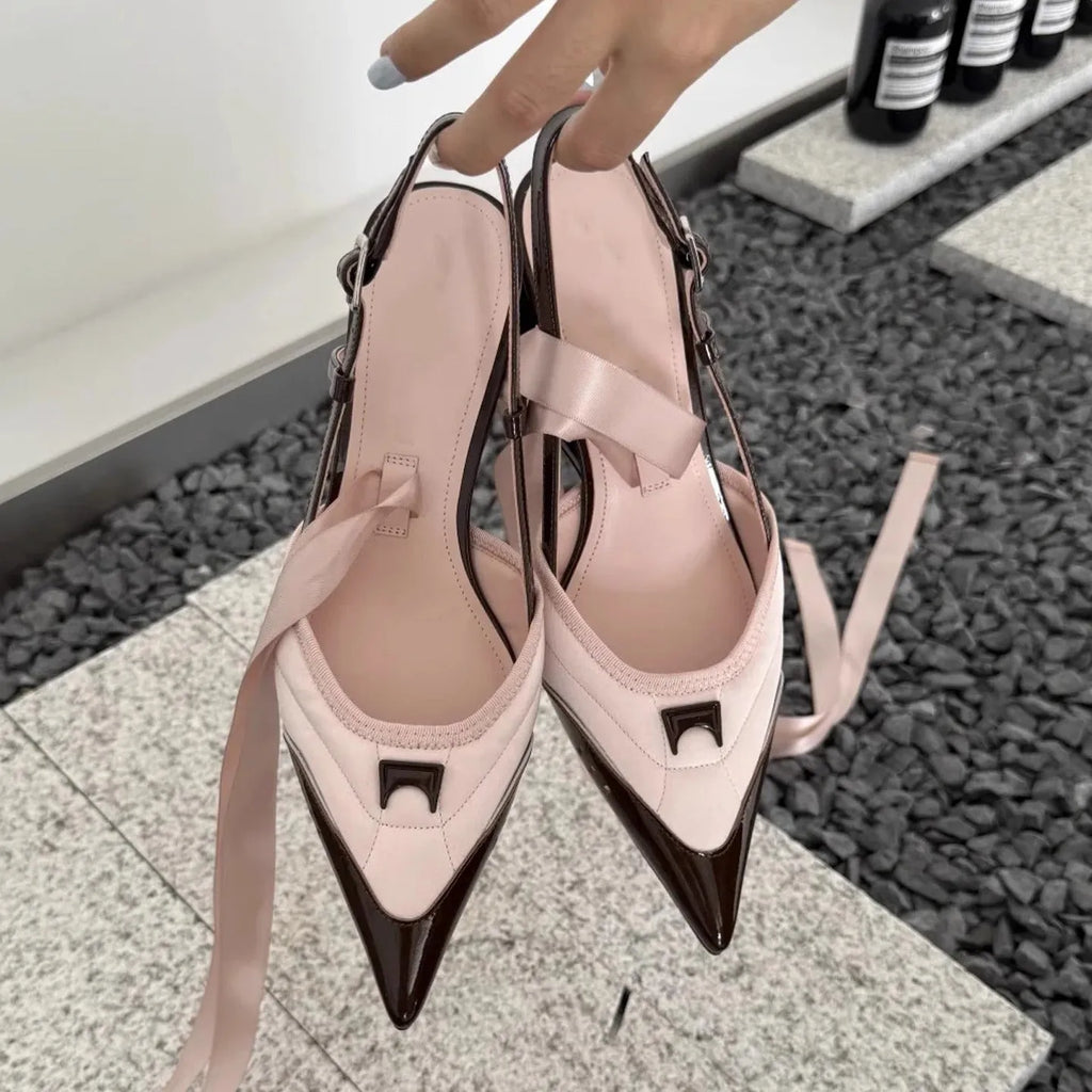 Women's special-shaped root lace-up high heels in black and pink, showing cowhide upper and lace detail.