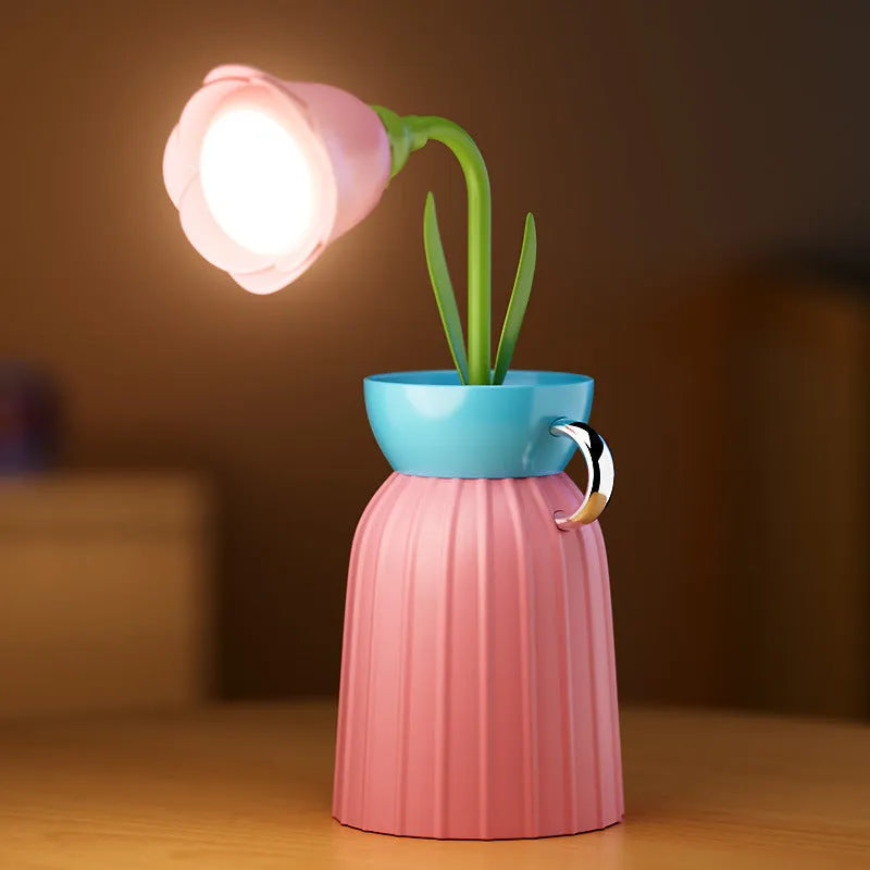 LED flower lamp in pink rose style with USB cable, 30cm tall, on a bedroom table
