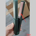 Pink and green cordless USB hair straightener and curler with ceramic plates, shown with USB cable.