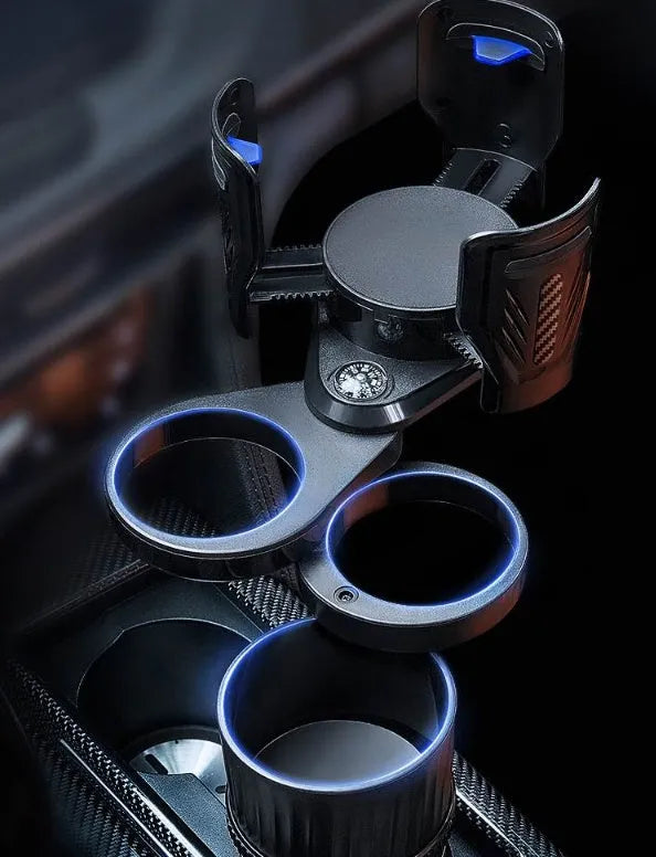 Retractable black car drink cup holder with adjustable base on a car console.