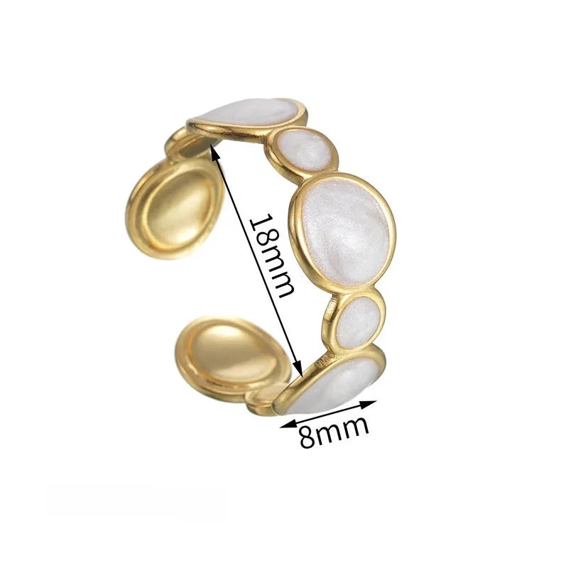 A geometric stainless steel ring for women with an adjustable opening and electroplated finish.