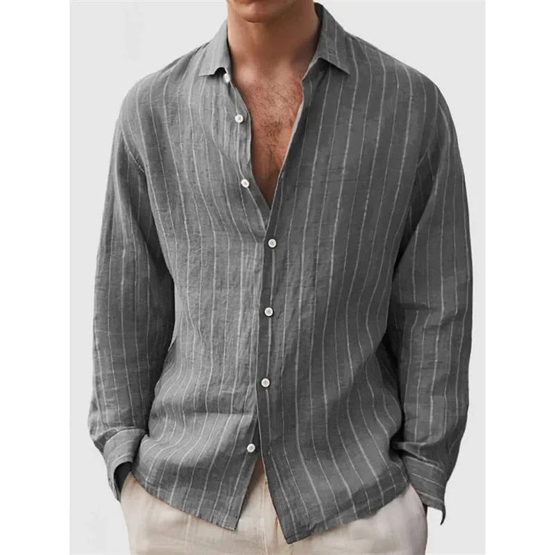 Man wearing a loose-fit, striped, short-sleeve cardigan shirt in a casual setting.