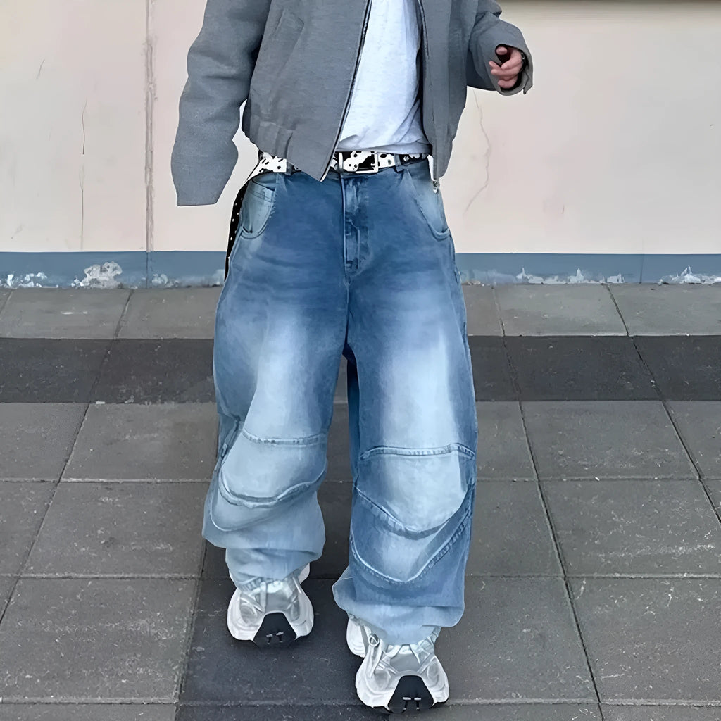 Blue baggy straight-leg jeans with a zip fly, shown in a washed white blue colour.