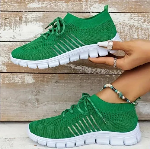 High-cut lace-up platform sneaker in a casual style with a breathable fabric upper and flat rubber sole.
