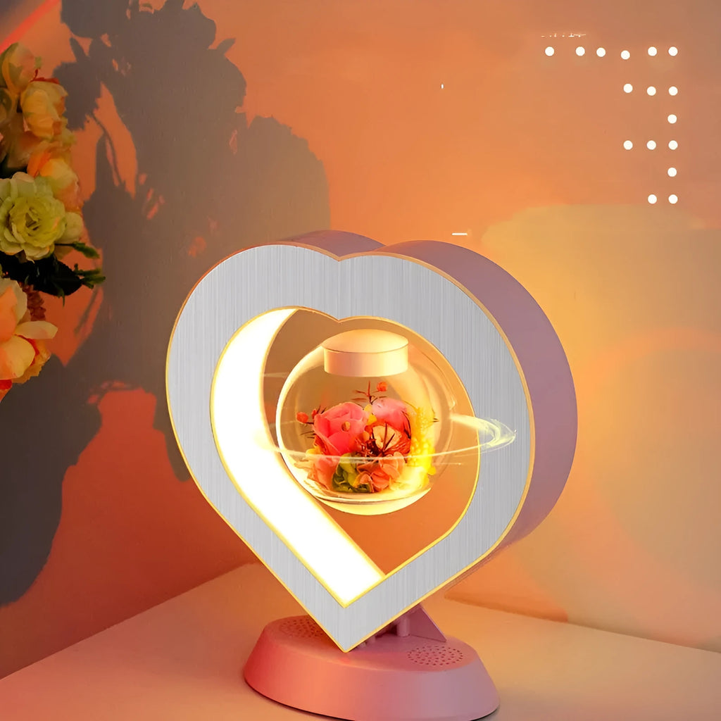 Magnetic levitation lamp with pink eternal rose inside transparent sphere and Bluetooth speaker on USB base