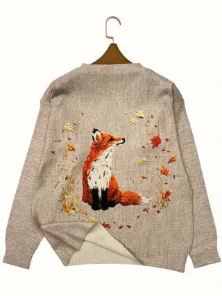 Loose-fit digital printed top with lapel collar on a hanger, shown in available sizes.