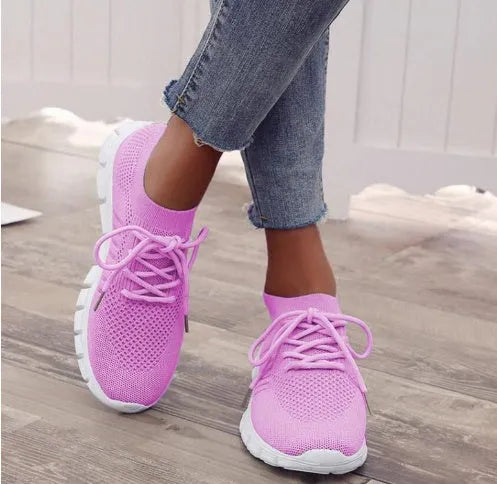 High-cut lace-up platform sneaker in a casual style with a breathable fabric upper and flat rubber sole.