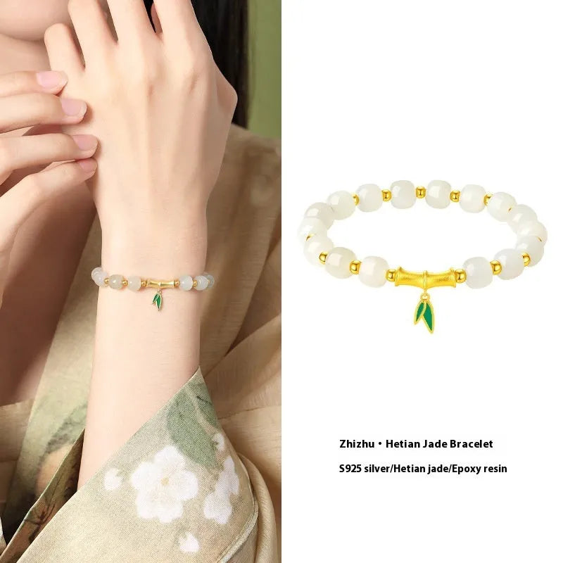 S925 sterling silver bracelet with round Hetian jade beads and bamboo leaf charms.