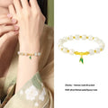 S925 sterling silver bracelet with round Hetian jade beads and bamboo leaf charms.